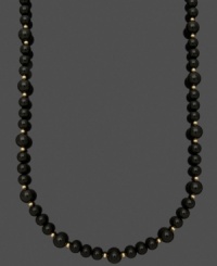 Bold beads create a standout look. A simple strand of polished onyx beads (8-10 mm) mixed with 14k gold accent beads and clasp make for a timeless look. Approximate length: 18 inches. Bold beads create a standout look. A simple strand of polished onyx beads (8-10 mm) mixed with 14k gold accent beads and clasp make for a timeless look. Approximate length: 18 inches.