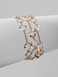 A beautifully crafted chain link punctuated with slim hammered circle links for a thoroughly modern look. 18k gold and sterling silver with 18k rose goldplatingLength, about 7½Fold-over clasp closureImported 