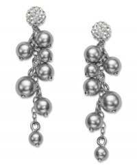 A modern interpretation of a timeless classic. Shining in silver tones, Swarovski's sophisticated pair of rhodium-plated mixed metal pierced earrings enhances any outfit, by day or night. A majestic accumulation of grey crystal pearls dangle from each sparkling stud in clear crystal Pointiage®. Approximate drop: 1-5/8 inches. A modern interpretation of a timeless classic. Shining in silver tones, Swarovski's sophisticated pair of rhodium-plated mixed metal pierced earrings enhances any outfit, by day or night. A majestic accumulation of grey crystal pearls dangle from each sparkling stud in clear crystal Pointiage®. Approximate drop: 1-5/8 inches.