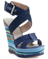 Here comes summer style. With an earthy, woven wraparound strap at the ankle and a sky-high wedge heel with braided trim at the bottom, the Surayya platform sandals by RACHEL Rachel Roy are decked out and ready for sun. Here comes summer style. With an earthy, woven wraparound strap at the ankle and a sky-high wedge heel with braided trim at the bottom, the Surayya platform sandals by RACHEL Rachel Roy are decked out and ready for sun.