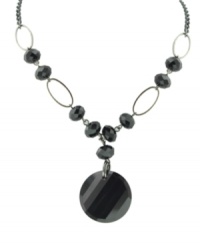 Well-rounded: Graceful oval shapes complement a dramatic circular pendant on 2028's Y necklace. Crafted in hematite tone mixed metal with jet beads. Approximate length: 16 inches + 3-inch extender. Approximate drop: 2 inches. Well-rounded: Graceful oval shapes complement a dramatic circular pendant on 2028's Y necklace. Crafted in hematite tone mixed metal with jet beads. Approximate length: 16 inches + 3-inch extender. Approximate drop: 2 inches.