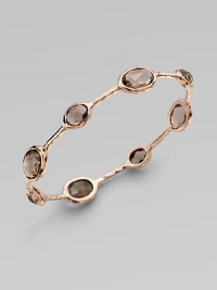 From the Rock Candy® Collection. Beautifully faceted smokey quartz stones set in sterling silver and 18k gold, finished in the warm glow of 18k rose goldplating. Smokey quartz18k gold and sterling silver with 18k rose goldplatingDiameter, about 2½Slip-on styleImported From the Rock Candy® Collection. Beautifully faceted smokey quartz stones set in sterling silver and 18k gold, finished in the warm glow of 18k rose goldplating. Smokey quartz18k gold and sterling silver with 18k rose goldplatingDiameter, about 2½Slip-on styleImported