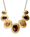 With antiqued appeal, this statement necklace from Style&co. flaunts hammered pendants with smoky resin accents. Crafted in matte gold tone mixed metal. Approximate length: 18 inches. Approximate drop: 5-1/2 inches.