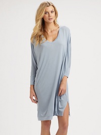 Dolman sleeves and an elasticized back waistband modernize this flattering silhouette for everyday wear. V-neckDropped shouldersThree-quarter length dolman sleevesBanded cuffs and hemSide slitsBack ruched elastic waistbandAbout 37 from shoulder to hemModal/viscoseHand washImported Dolman sleeves and an elasticized back waistband modernize this flattering silhouette for everyday wear. V-neckDropped shouldersThree-quarter length dolman sleevesBanded cuffs and hemSide slitsBack ruched elastic waistbandAbout 37 from shoulder to hemModal/viscoseHand washImported