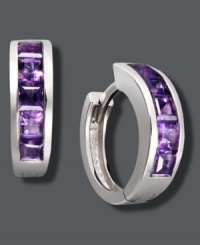 Purple hues give traditional hoops a poignant touch. Set in sterling silver, hoops feature baguette-cut, channel-set amethyst (1-1/2 ct. t.w.). Approximate diameter: 1/2 inch. Purple hues give traditional hoops a poignant touch. Set in sterling silver, hoops feature baguette-cut, channel-set amethyst (1-1/2 ct. t.w.). Approximate diameter: 1/2 inch.