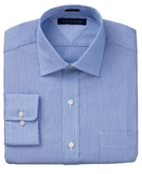 A spread collar and slim fit tailoring add to the sleek appeal of this dress shirt from Tommy Hilfiger. A spread collar and slim fit tailoring add to the sleek appeal of this dress shirt from Tommy Hilfiger.