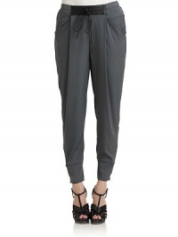THE LOOKElastic waist with leather detail and drawstring tieDual besom pocketsBanded, zip cuffsTHE FITRise, about 12Inseam, about 26THE MATERIALBody: polyesterSecond fabric: leatherCARE & ORIGINDry cleanImportedModel shown is 5'10½ (179cm) wearing US size Small. THE LOOKElastic waist with leather detail and drawstring tieDual besom pocketsBanded, zip cuffsTHE FITRise, about 12Inseam, about 26THE MATERIALBody: polyesterSecond fabric: leatherCARE & ORIGINDry cleanImportedModel shown is 5'10½ (179cm) wearing US size Small.