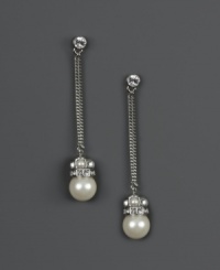 Redefine elegance when you add dramatic drops to your evening wear. Givenchy earrings feature a chic, linear design that highlights polished glass pearls (10 mm) and sparkling crystals. Set in silver tone mixed metal. Approximate drop: 1-1/4 inches.