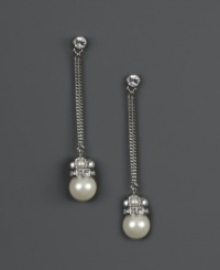 Redefine elegance when you add dramatic drops to your evening wear. Givenchy earrings feature a chic, linear design that highlights polished glass pearls (10 mm) and sparkling crystals. Set in silver tone mixed metal. Approximate drop: 1-1/4 inches. Redefine elegance when you add dramatic drops to your evening wear. Givenchy earrings feature a chic, linear design that highlights polished glass pearls (10 mm) and sparkling crystals. Set in silver tone mixed metal. Approximate drop: 1-1/4 inches.