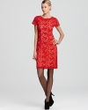 A vibrantly hued lining lends trend-right appeal to a feminine Elie Tahari dress, crafted in crocheted lace.