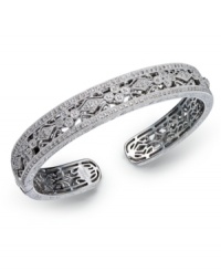 Deck yourself out in diamonds. This exquisite bangle features a cut-out floral pattern decorated with round-cut diamonds (1/2 ct. t.w.). Set in sterling silver. Approximate diameter 2-1/2 inches. Deck yourself out in diamonds. This exquisite bangle features a cut-out floral pattern decorated with round-cut diamonds (1/2 ct. t.w.). Set in sterling silver. Approximate diameter 2-1/2 inches.