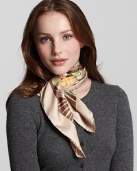 A vibrant silk scarf with a fierce jungle pattern by Salvatore Ferragamo. A vibrant silk scarf with a fierce jungle pattern by Salvatore Ferragamo.