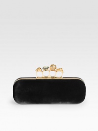 Plush and rich velvet with a skull accented knuckle duster closure.Knuckle duster top clasp closureLeather lining8¾W X 3H X 1½DMade in Italy Plush and rich velvet with a skull accented knuckle duster closure.Knuckle duster top clasp closureLeather lining8¾W X 3H X 1½DMade in Italy
