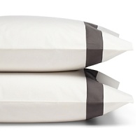 A classic charcoal gray sateen border trims these pillowcases by SFERRA, woven from super soft Egyptian cotton. A classic charcoal gray sateen border trims these pillowcases by SFERRA, woven from super soft Egyptian cotton.