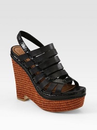 Strappy leather slingback has snake-print leather trim and a woven raffia wedge. Raffia and snake-print leather wedge, 5 (125mm)Raffia platform, 2 (50mm)Compares to a 3 heel (75mm)Leather and snake-print leather upperLeather lining and solePadded insoleImportedOUR FIT MODEL RECOMMENDS ordering one half size up as this style runs small. Strappy leather slingback has snake-print leather trim and a woven raffia wedge. Raffia and snake-print leather wedge, 5 (125mm)Raffia platform, 2 (50mm)Compares to a 3 heel (75mm)Leather and snake-print leather upperLeather lining and solePadded insoleImportedOUR FIT MODEL RECOMMENDS ordering one half size up as this style runs small.