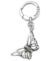 Flight of fancy. Fossil's breezy butterfly charm features a delicate openwork design with reconstituted turquoise accents. Set in silver tone mixed metal. Approximate drop: 1 inch. Flight of fancy. Fossil's breezy butterfly charm features a delicate openwork design with reconstituted turquoise accents. Set in silver tone mixed metal. Approximate drop: 1 inch.