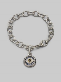 Bold, textured links of sterling silver hold a protective evil eye charm, radiantly created of white, blue and black sapphires with a touch of 18k gold. Sapphires Sterling silver and 18k yellow gold Bracelet length, about 7½ Charm diameter, about ¾ Heart-shaped lobster clasp Made in USA