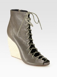 Lustrous leather go-to with a lace-up front and chunky espadrille wedge. Hemp wedge, 4 (100mm)Leather upperSide zipperLeather liningRubber solePadded insoleImportedOUR FIT MODEL RECOMMENDS ordering one size up as this style runs small. Lustrous leather go-to with a lace-up front and chunky espadrille wedge. Hemp wedge, 4 (100mm)Leather upperSide zipperLeather liningRubber solePadded insoleImportedOUR FIT MODEL RECOMMENDS ordering one size up as this style runs small.