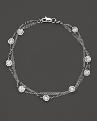 Perfectly elegant, a 3-chain white gold necklace with gleaming diamond stations. Perfectly elegant, a 3-chain white gold necklace with gleaming diamond stations.