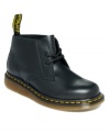 Sturdy and low. The Manton booties by Dr. Martens have a mini lace-up vamp and contrasting stitching around the sole.
