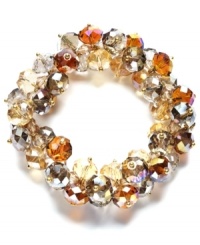 Add drops of color in rich, golden hues. This elegant stretch bracelet from c.A.K.e. by Ali Khan features champagne and neutral-colored glass beads clustered together. Crafted in gold tone mixed metal, it stretches to fit wrist. Approximate diameter: 2 inches. Add drops of color in rich, golden hues. This elegant stretch bracelet from c.A.K.e. by Ali Khan features champagne and neutral-colored glass beads clustered together. Crafted in gold tone mixed metal, it stretches to fit wrist. Approximate diameter: 2 inches.