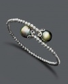 Wrap your wrists with the perfect finishing touch. Elegant bracelet features a unique, wrapped cuff design with cultured Tahitian pearl (9-10 mm) ends and sparkle bead accents. Crafted in sterling silver. Approximate length: 7-1/2 inches.