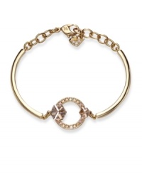 Brilliant and beautiful. Adorned with sparkling Moonlight and Golden Shadow crystals, Swarovski's geometric bangle bracelet will command attention whenever you wear it. Crafted in gold tone mixed metal. Approximate diameter: 2-3/8 inches. Brilliant and beautiful. Adorned with sparkling Moonlight and Golden Shadow crystals, Swarovski's geometric bangle bracelet will command attention whenever you wear it. Crafted in gold tone mixed metal. Approximate diameter: 2-3/8 inches.