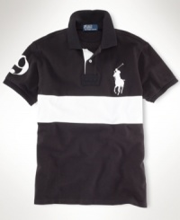 Channeling iconic, sporty style with bold pieced detailing, a handsome short-sleeved polo is cut for a comfortable fit from breathable cotton mesh. Channeling iconic, sporty style with bold pieced detailing, a handsome short-sleeved polo is cut for a comfortable fit from breathable cotton mesh.