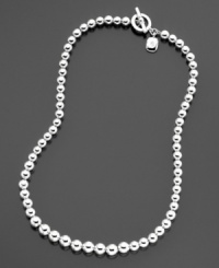 A sophisticated style you'll love: a silvertone graduated ball necklace from Lauren Ralph Lauren with a cute logo charm and toggle closure. Length measures 16 inches. A sophisticated style you'll love: a silvertone graduated ball necklace from Lauren Ralph Lauren with a cute logo charm and toggle closure. Length measures 16 inches.
