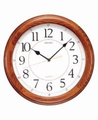 This handsome wall clock from Seiko features a beautiful solid oak case. Round white dial with logo, numeral indices and quiet sweep second hand. One AA battery included. Measures approximately 13 inches in diameter and 1-1/2 inches deep. This handsome wall clock from Seiko features a beautiful solid oak case. Round white dial with logo, numeral indices and quiet sweep second hand. One AA battery included. Measures approximately 13 inches in diameter and 1-1/2 inches deep.