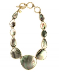 Jones New York's elegant collar necklace catches the eye with brown mother-of-pearl shell graduated pendants. Crafted in worn gold tone mixed metal with toggle closure. Approximate length: 16 inches + 3-inch extender. Jones New York's elegant collar necklace catches the eye with brown mother-of-pearl shell graduated pendants. Crafted in worn gold tone mixed metal with toggle closure. Approximate length: 16 inches + 3-inch extender.