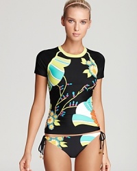 Surfer chic: This stylishly retro rashguard will have you riding the waves or stand up paddleboarding in style, by designer Trina Turk. It's also a cute coverup. Surfer chic: This stylishly retro rashguard will have you riding the waves or stand up paddleboarding in style, by designer Trina Turk. It's also a cute coverup.