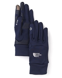 The North Face® E-Tip stretch gloves boast innovative technology-friendly finger patches. The North Face® E-Tip stretch gloves boast innovative technology-friendly finger patches.