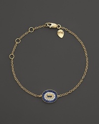 Sapphire and white diamonds add sparkle to a 14K. yellow gold evil eye bracelet by Meira T. Sapphire and white diamonds add sparkle to a 14K. yellow gold evil eye bracelet by Meira T.