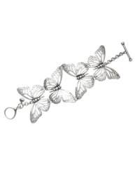Let your natural side take flight. Fossil's whimsical bracelet features four, cut-out butterflies set in silver tone mixed metal with a toggle clasp and crystal details. Approximate length: 7-1/2 inches. Let your natural side take flight. Fossil's whimsical bracelet features four, cut-out butterflies set in silver tone mixed metal with a toggle clasp and crystal details. Approximate length: 7-1/2 inches.