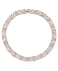 A contemporary take on a classic. This sterling silver two-row necklace features peach and pink button cultured freshwater pearls (6-1/2-7 mm) to stunning effect. Approximate length: 18 inches. A contemporary take on a classic. This sterling silver two-row necklace features peach and pink button cultured freshwater pearls (6-1/2-7 mm) to stunning effect. Approximate length: 18 inches.