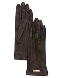 Chic lambskin gloves with perforated thumb and index fingers for easy phone dialing on those chilly nights. Chic lambskin gloves with perforated thumb and index fingers for easy phone dialing on those chilly nights.