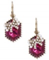 A pretty little package from Betsey Johnson. Drop earrings grab attention with fuchsia-colored crystal accents topped with glass pearl bow accents. A truly cute look for any outfit. Crafted in antiqued gold tone mixed metal. Approximate drop: 1-1/3 inches.