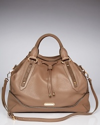This leather Burberry satchel refines a daytime look with its slightly structured silhouette, finished in suede trims which lend just the right touch of texture. This leather Burberry satchel refines a daytime look with its slightly structured silhouette, finished in suede trims which lend just the right touch of texture.
