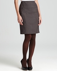A careerist essential, this T Tahari skirt streamlines your 9-to5 style with a sleek silhouette finished with flattering vertical seaming. A careerist essential, this T Tahari skirt streamlines your 9-to5 style with a sleek silhouette finished with flattering vertical seaming.