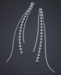 Take your style to new lengths with these stunning GUESS earrings featuring beautiful strands of crystal accents set in silvertone mixed metal. Approximate drop: 4 inches. Take your style to new lengths with these stunning GUESS earrings featuring beautiful strands of crystal accents set in silvertone mixed metal. Approximate drop: 4 inches.