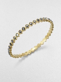 Lovely faceted glass stones in the soft hue of amethyst or a bold silver flare are dotted along a slender bangle with a golden finish.GlassGoldtoneDiameter, about 2.5Imported Lovely faceted glass stones in the soft hue of amethyst or a bold silver flare are dotted along a slender bangle with a golden finish.GlassGoldtoneDiameter, about 2.5Imported