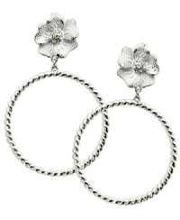 Petal perfect. Delicate white and crystal-accented flowers adorn GUESS's feminine earrings. Crafted in imitation rhodium-plated mixed metal with an intricate twisted hoop setting and post backing. Approximate drop: 3 inches. Petal perfect. Delicate white and crystal-accented flowers adorn GUESS's feminine earrings. Crafted in imitation rhodium-plated mixed metal with an intricate twisted hoop setting and post backing. Approximate drop: 3 inches.