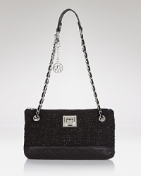 DKNY's leather and tweed shoulder bag channels ladylike style for all occasions. DKNY's leather and tweed shoulder bag channels ladylike style for all occasions.