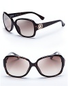 Classic Michael Kors, these face-flattering sunnies feature square frames, gradient lenses and logos at the temples-perfect for year-round wear.