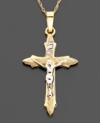 Soft edges and a rounded style characterize this lovely cross charm set in 14k gold and 14k white gold. Approximate length: 1-1/4 inches. Chain not included. Soft edges and a rounded style characterize this lovely cross charm set in 14k gold and 14k white gold. Approximate length: 1-1/4 inches. Chain not included.