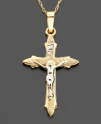 Soft edges and a rounded style characterize this lovely cross charm set in 14k gold and 14k white gold. Approximate length: 1-1/4 inches. Chain not included.