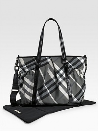 With the look of a classic tote, this check bag holds everything your baby needs in sophisticated Burberry style. Double handles, 10 drop Adjustable, detachable shoulder strap, 22 drop Top zip closure Outside open pouches Inside zip and open pockets Removable changing mat 17W X 13H X 6D PVC Imported With the look of a classic tote, this check bag holds everything your baby needs in sophisticated Burberry style. Double handles, 10 drop Adjustable, detachable shoulder strap, 22 drop Top zip closure Outside open pouches Inside zip and open pockets Removable changing mat 17W X 13H X 6D PVC Imported