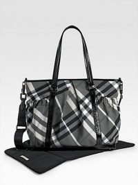 With the look of a classic tote, this check bag holds everything your baby needs in sophisticated Burberry style. Double handles, 10 drop Adjustable, detachable shoulder strap, 22 drop Top zip closure Outside open pouches Inside zip and open pockets Removable changing mat 17W X 13H X 6D PVC Imported