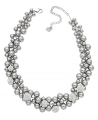 Shining in stunning silver tones, Swarovski's magnificent necklace offers a modern interpretation of a timeless classic: the pearl necklace. It features a majestic accumulation of grey crystal pearls highlighted with subtle details in sparkling clear crystal Pointiage. The rhodium-plated closure is adjustable. Crafted in mixed metal. Approximate length: 14 inches + 2-inch extender. Shining in stunning silver tones, Swarovski's magnificent necklace offers a modern interpretation of a timeless classic: the pearl necklace. It features a majestic accumulation of grey crystal pearls highlighted with subtle details in sparkling clear crystal Pointiage. The rhodium-plated closure is adjustable. Crafted in mixed metal. Approximate length: 14 inches + 2-inch extender.